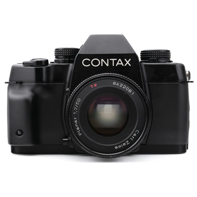 Occasion Contax ST Schwarz + Carl Zeiss Planar 50 mm f/1.7 T*