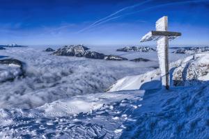 wind-blown rime ice found on a summit cross