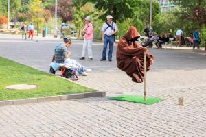 Street performer simulating levitation