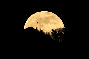 full moon rising behind Hammetschwand Restaurant