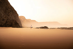 Lone footprints in the cold sand