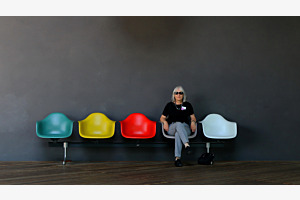 Woman in grey chair