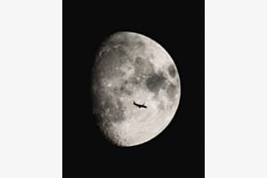 Night flight past the moon