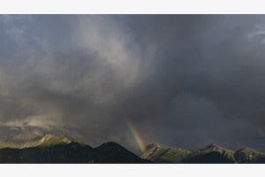 Cloud swallows rainbow